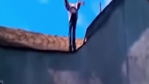 Crack-man does a backflip off of a 2 story building. Amazing! (Take 1829)