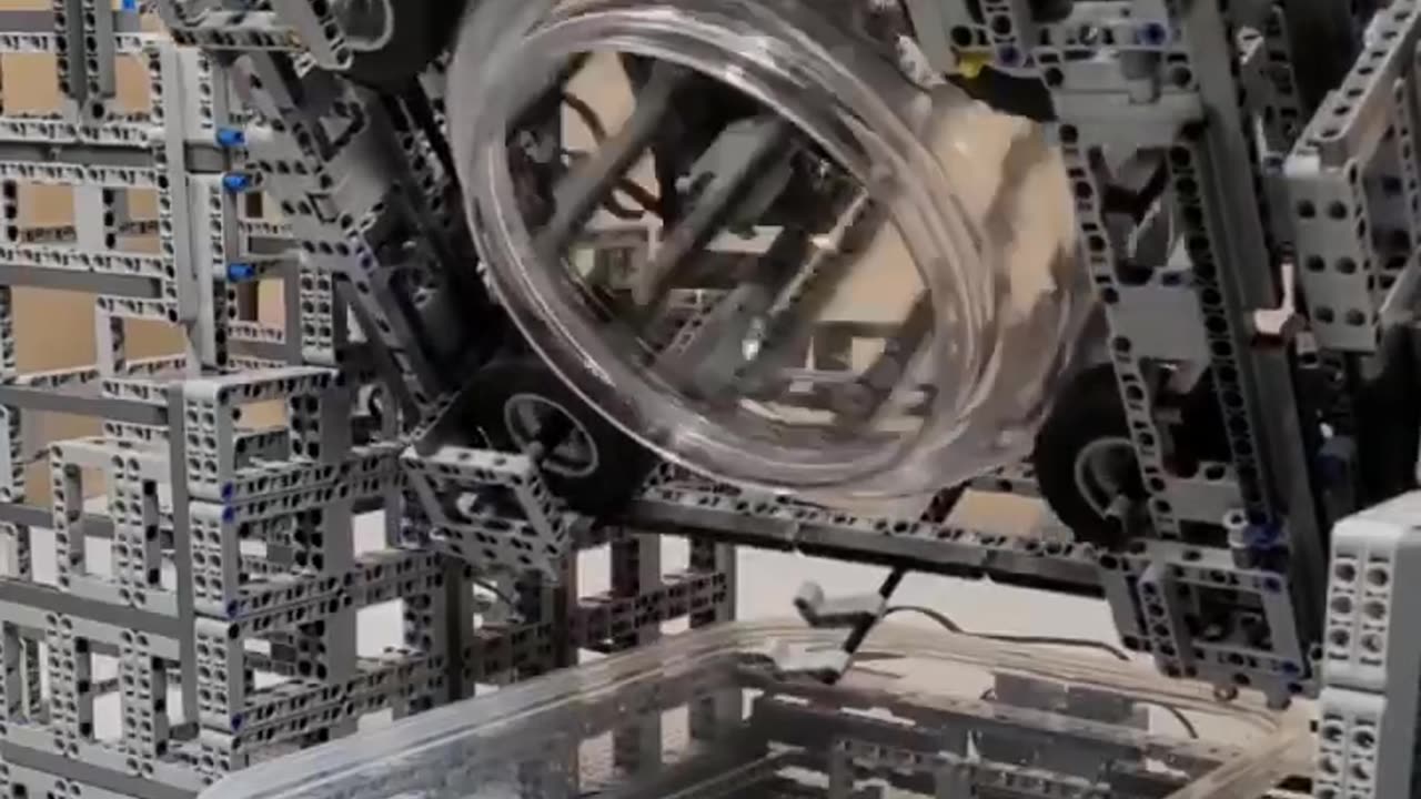 THIS GUY ASSEMBLED A WASHING MACHINE FROM LEGO PARTS THAT WASHES DRIES AND IRONS CLOTHES