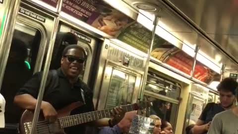 Guy singing lil jon yeah on subway guitar
