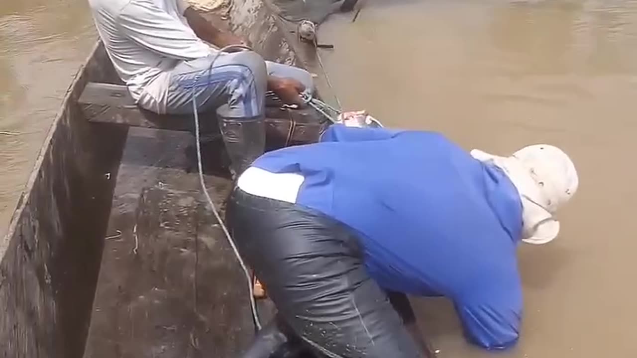 Men Battle Monster Fish