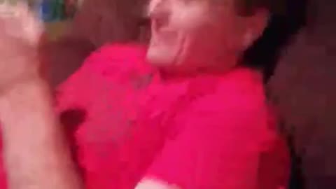 Guy red shirt showing friends bent finger