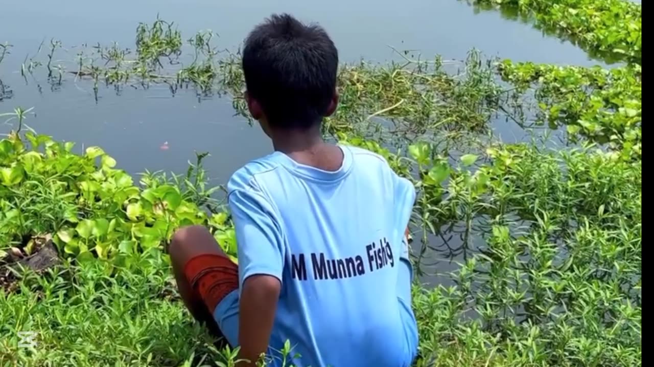 A small child was fishing in the lake until he fell into the lake