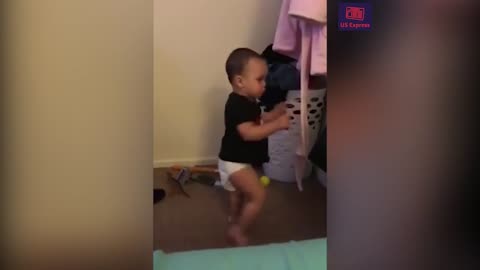 Adorable baby boxer tries out moves