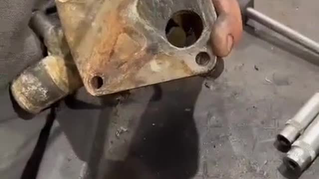 The small parts in the car engine are removed