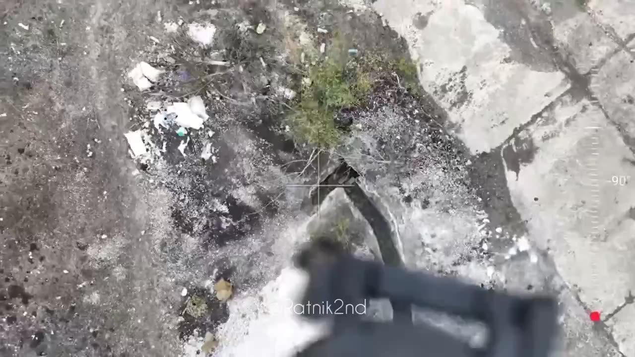 A Russian quadrocopter drops a grenade on a Ukrainian ammunition depot.