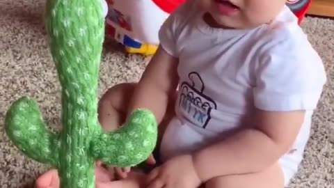 Babies play dancing cactus toy