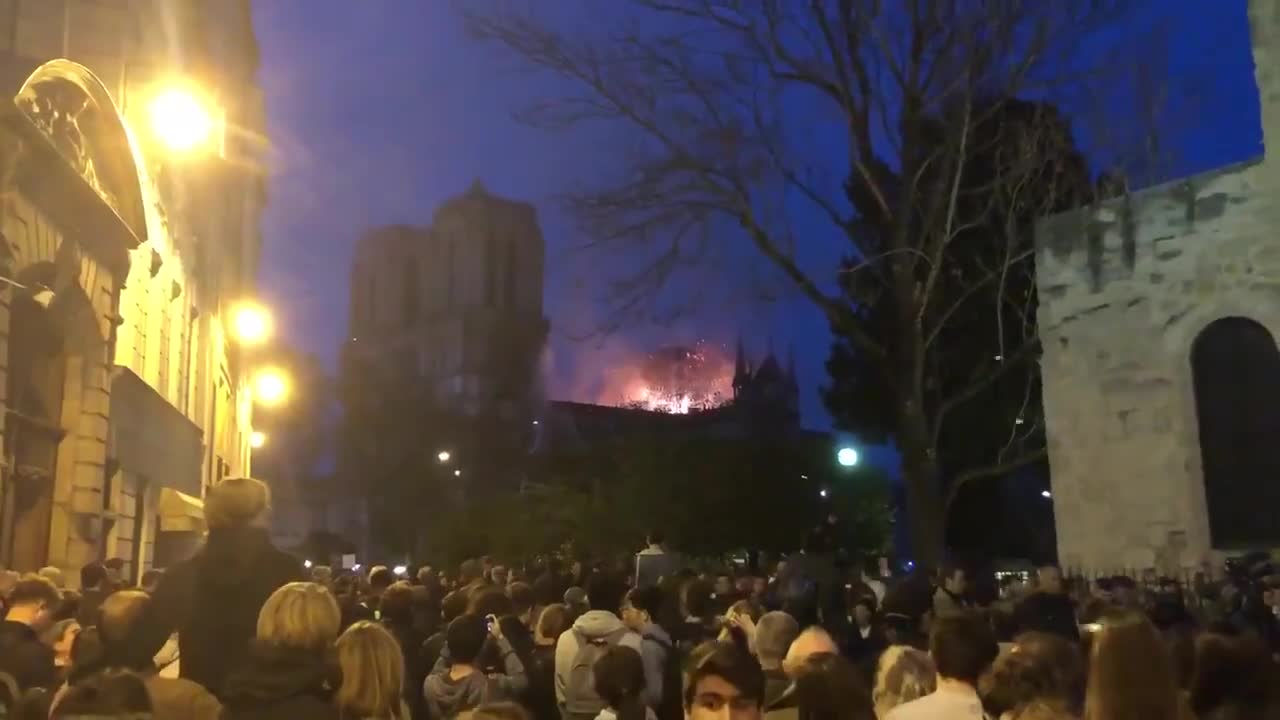 Crowd Sings Ave Maria as Notre Dame Burns