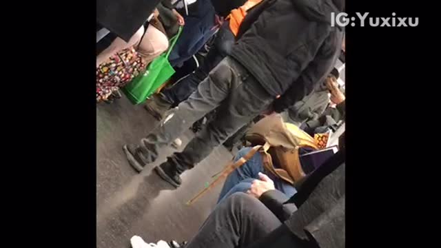 Group of people play dice on subway train
