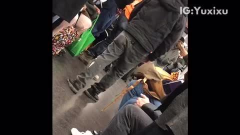 Group of people play dice on subway train