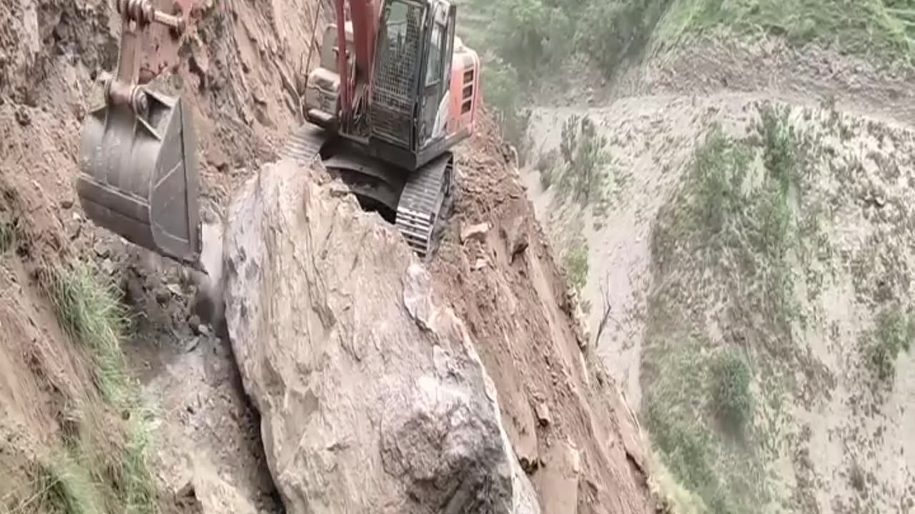 What happens when an Excavator hoists a rock 10 ti