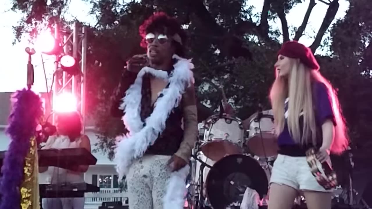 My daughter at the Biloxi MS Seafood Festival on stage with Purple Masquerade.