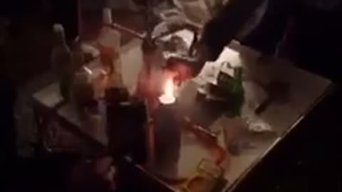 Music guy sprays fire at friend