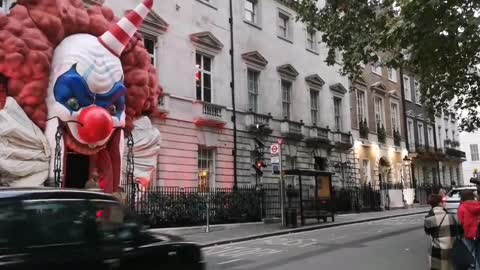 Giant clown face takes over entrance of private club in London