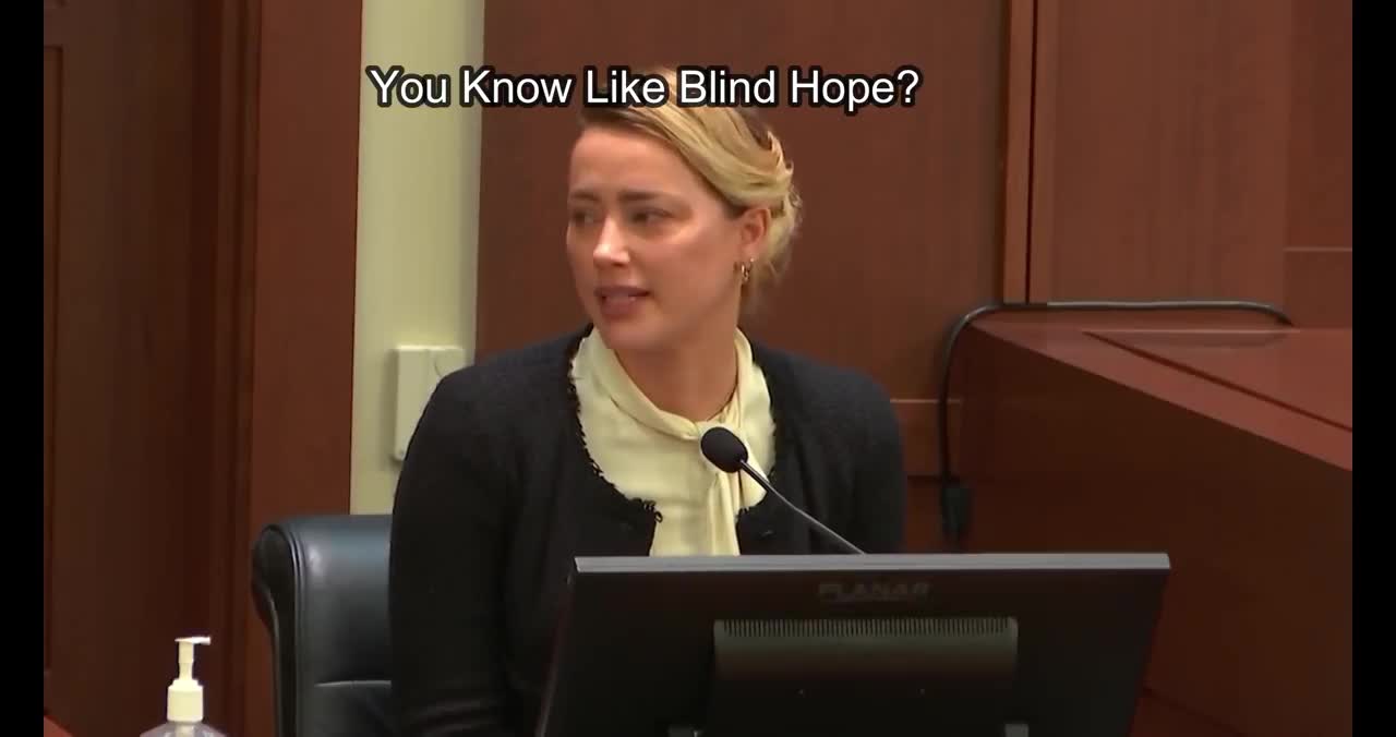 Amber Heard tries to avoid accidental laugh by crying