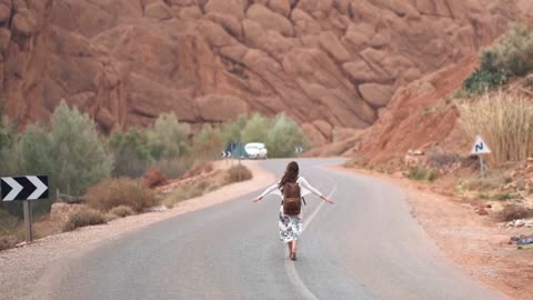 Someone walking middle of the road to beautiful life video