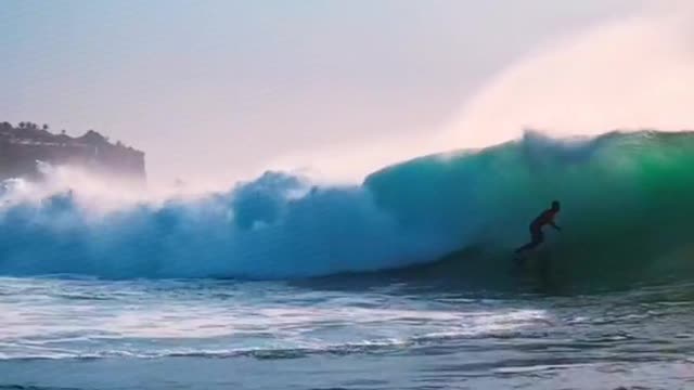 Drone Footage of a Surfer Barrelling a Wave