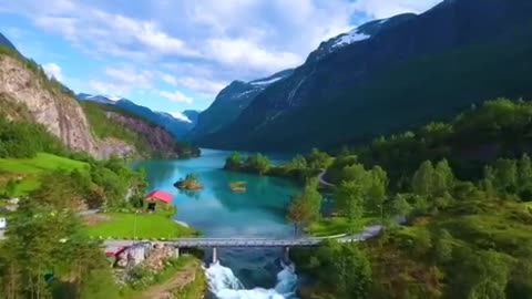 A blue river and a hut next to it