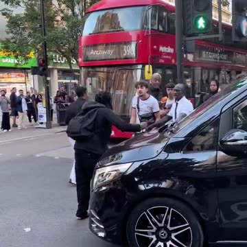 African immigrant attacks innocent Briton's car in London.