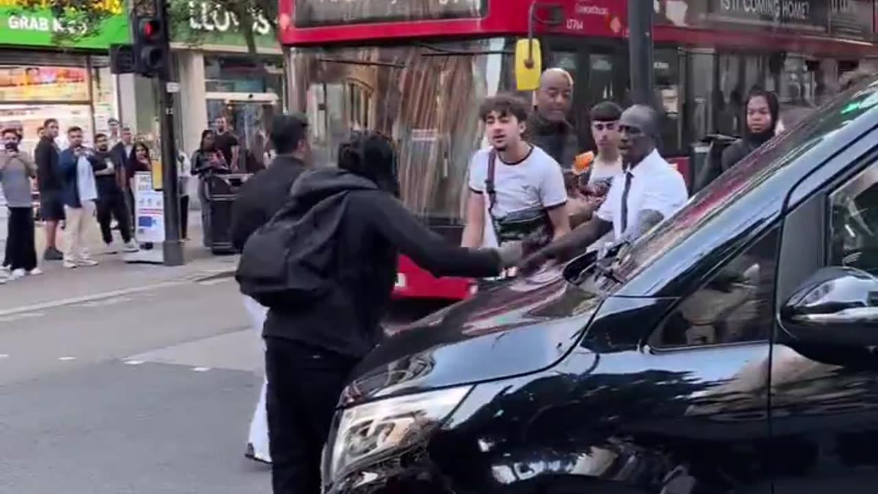 African immigrant attacks innocent Briton's car in London.