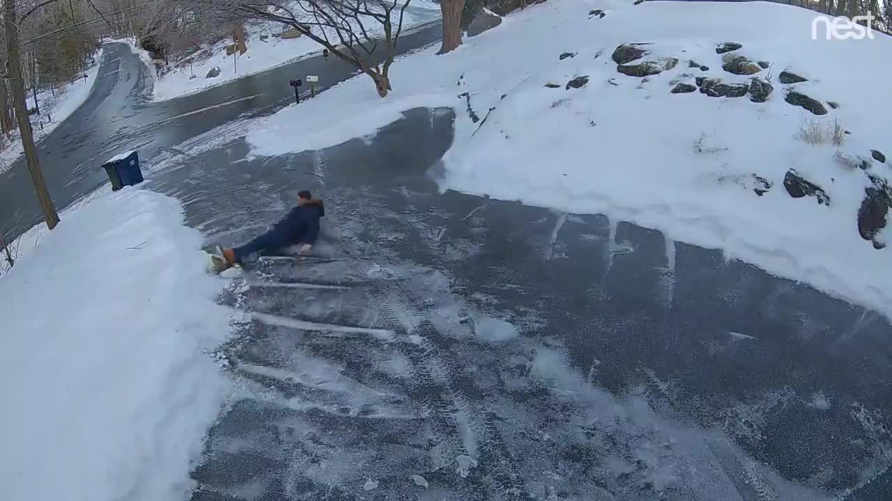 Man Slips Down Long Driveway Trying to Use Salt