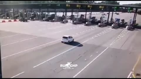 Car fails to see toll station in time and crashes into it.