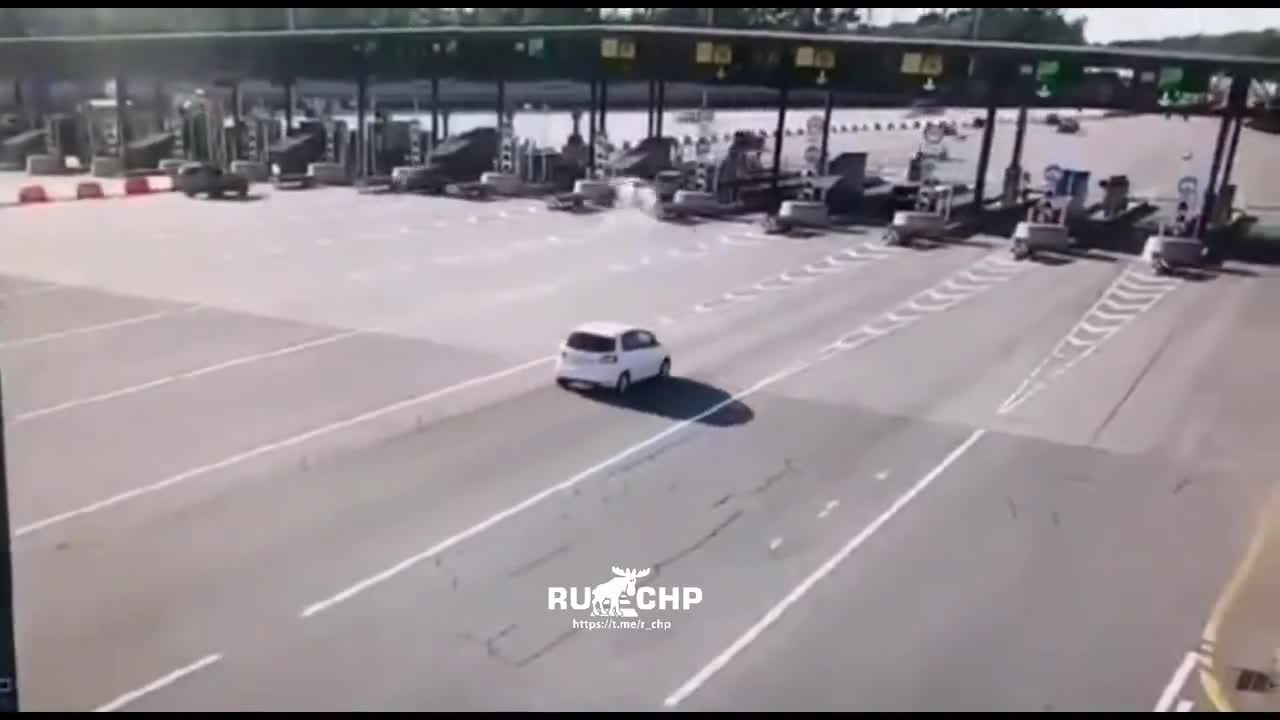 Car fails to see toll station in time and crashes into it.