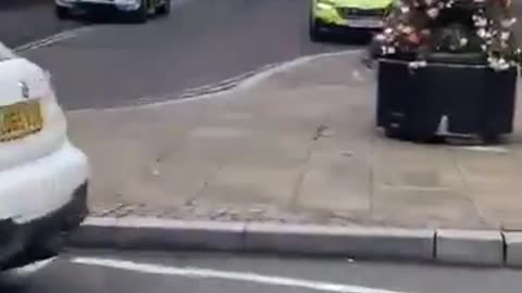 Armed Muslims march in Blackburn, UK.