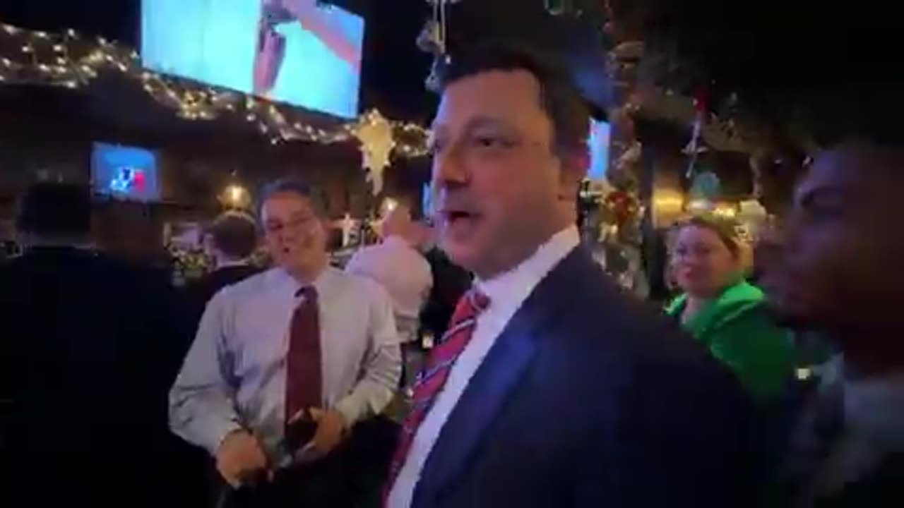 Daniel Penny and his defense team celebrate the not guilty verdict at a NYC pub.