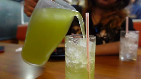Green Tea Pouring slow motion close up shot