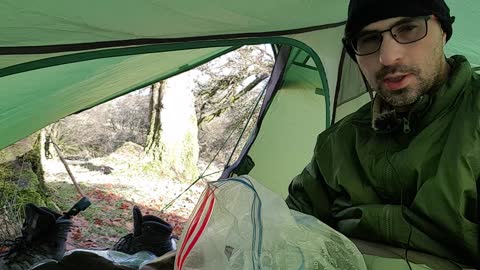 Sorting the camera out to film a vlog in the tent .