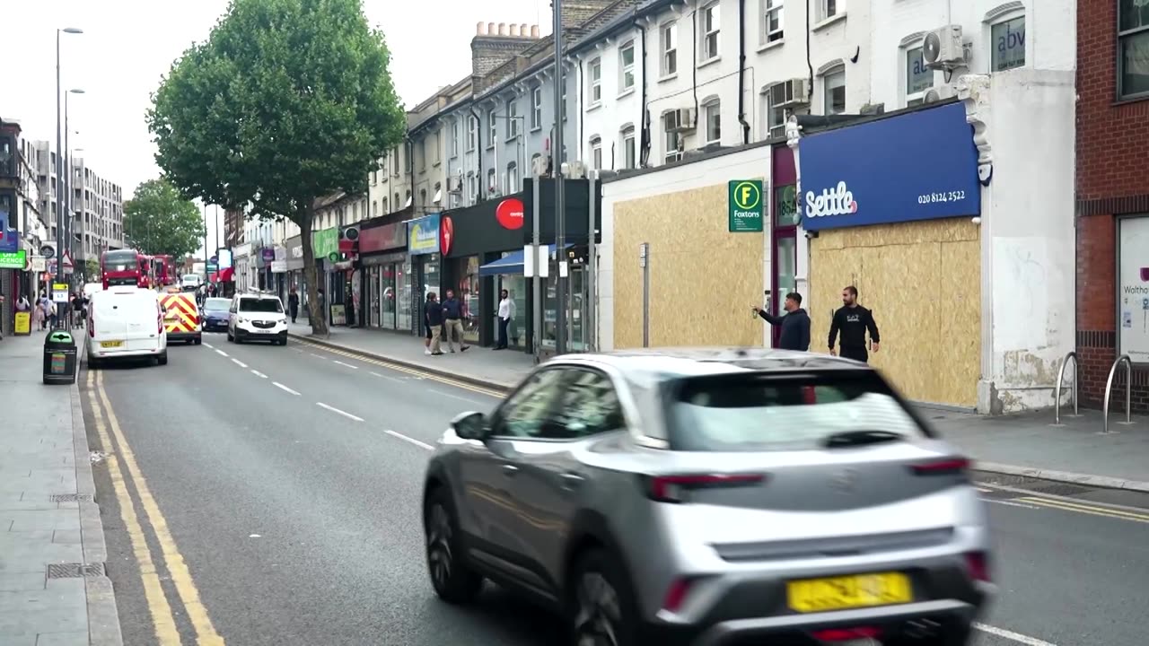 London shops board up windows in anticipation of more unrest