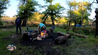 Evening cooking on a campfire next to a river