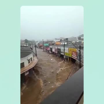 Flood drags car backwards onto some street in Brazil