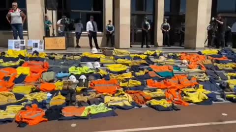 Powerful scenes of Patriots in Australia laying down their work uniforms