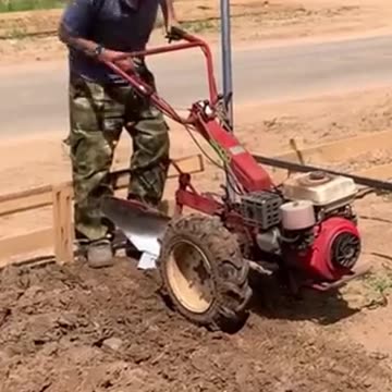Plowing the land with a mini tractor | Gasoline hand power tiller