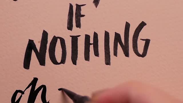A Person Writing the Word Changes on a Paper