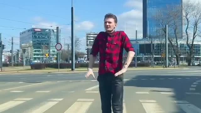 a man stops at the light and takes a little step top