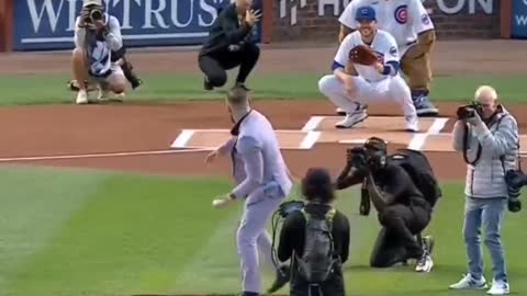 Conor McGregor fails a token serve at a baseball game