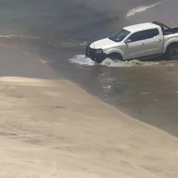 cars on the beach driving