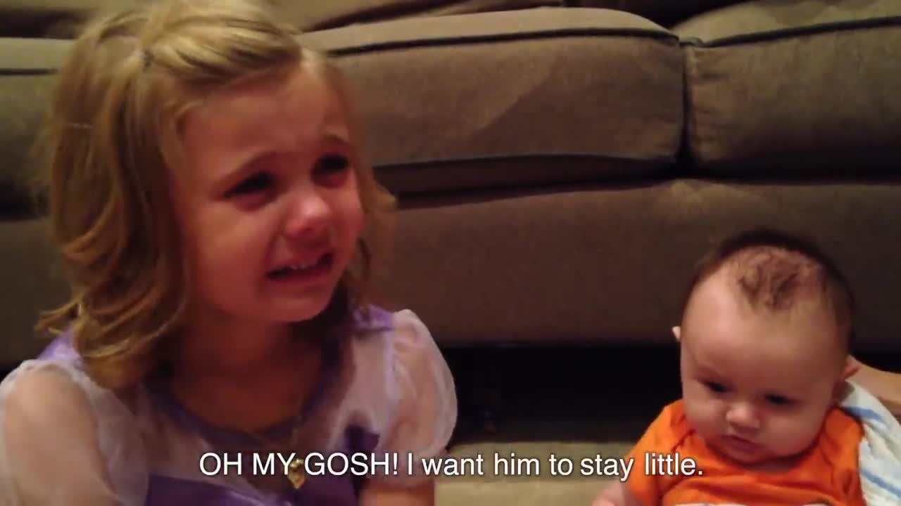 A little girl very happy for his little sister//He said his little sister is so cute