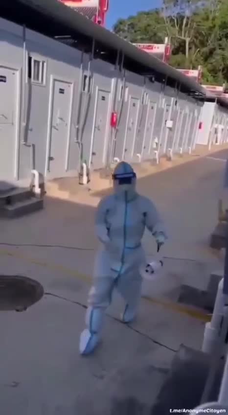 China: Inmates at quarantine camp delivered items through metal window