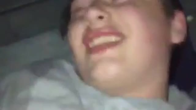 Guy grey shirt on floor throwing up