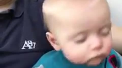 Cute and adorable baby fall asleep fast from daddy's hand swipe technique