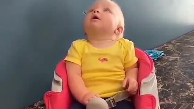 Baby hilarious reaction when toy is fall from roof