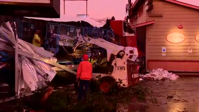 Amazon truck full of packages hydroplanes off I-35, crashes into Grady’s BBQ res