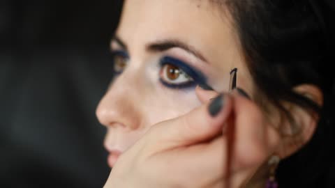 Woman Applying Eyebrows Makeup