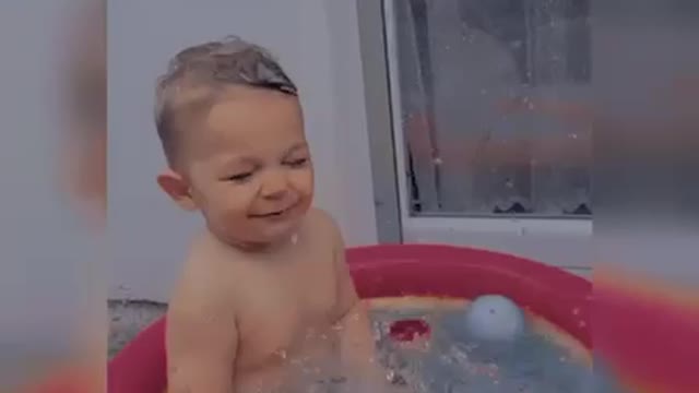 This child have fun in a small pool