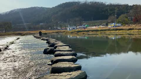 cross a stone bridge with a waddle