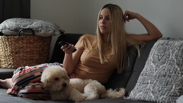 Girl Watching TV With Dog