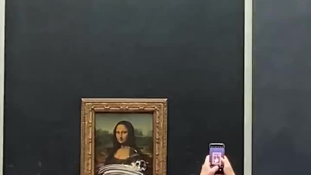 Crazy Activist SHOCKS World By Covering Famous Mona Lisa Painting In Cake